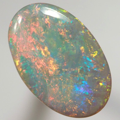 SOLID SEMI BLACK OPAL Top quality. Floral Harlequin pattern, very bright and sparkling red and orange. SEE VIDEO  
